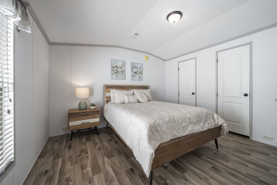 The queen bedroom home features